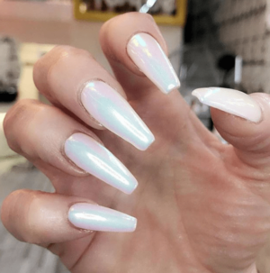 A person holding a white and blue manicure for Quinceanera