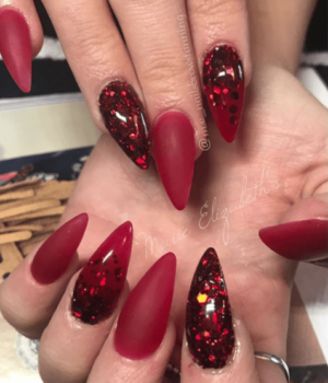 Quinceanera: Nail, a person holding a pair of red stils