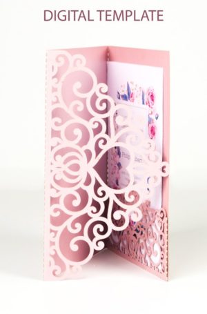A Quinceanera themed table with a pink card featuring a picture inside