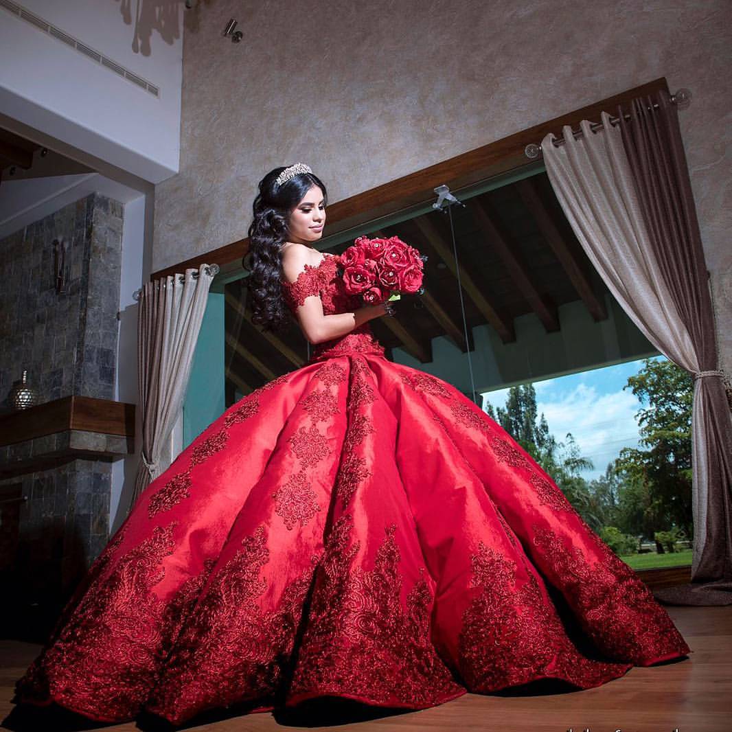 Quinceañera dresses, a woman in a red dress holding a bouquet for extra quince dresses