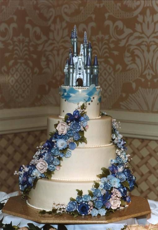 A Quinceañera with a Cinderella theme featuring a wedding cake with a castle on top
