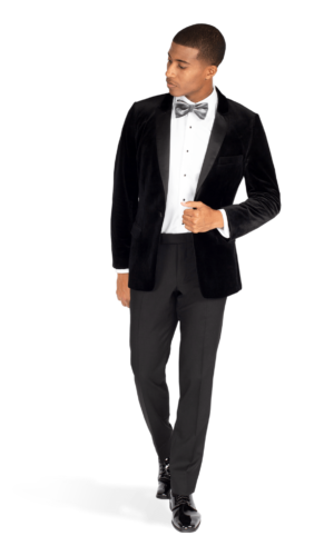 A man in a Quinceanera tuxedo and bow tie