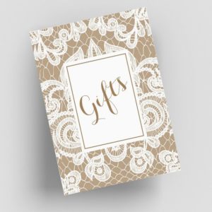 An image of a Quinceanera themed table with a gift box adorned with a white lace pattern.