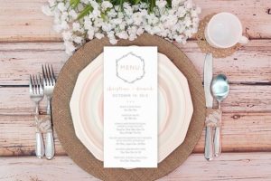 A Quinceanera table setting with a place setting and silverware