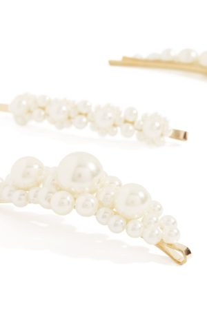 A pair of pearl hair pins on a white background, perfect for a Quinceanera
