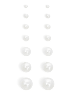 A group of white pearl earrings on a white surface, perfect for a Quinceanera