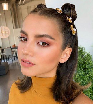 Quinceanera beauty, a woman wearing a yellow top and a gold headband