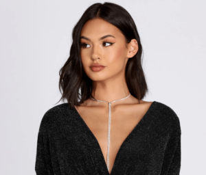 Quinceanera fashion model wearing a black dress and a choker necklace