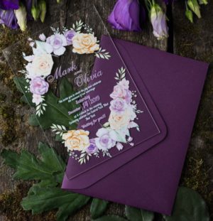 A close up of a Quinceanera invitation with flowers