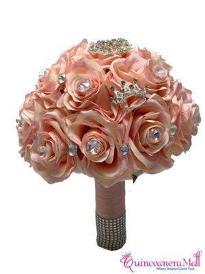 A beautiful Quinceanera floral bouquet featuring a stunning arrangement of pink roses adorned with a sparkling crystal brooch