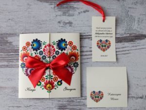 Quinceanera invitation, a heart shaped card with a red ribbon