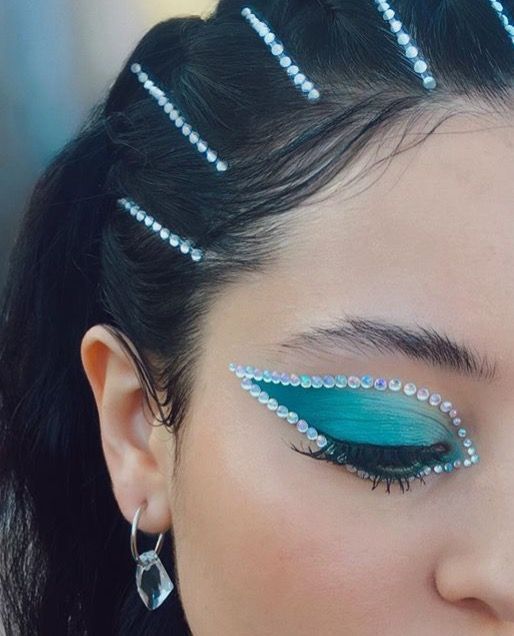 Close up of Alexa Demie, a woman with blue eye makeup. Maddy Perez makeups for Quinceanera