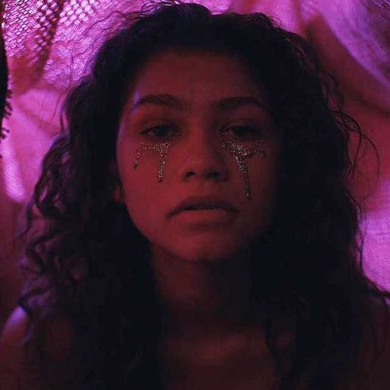 A photo of Zendaya, a young girl with glitter on her face, capturing the true euphoria aesthetic of a Quinceanera celebration.