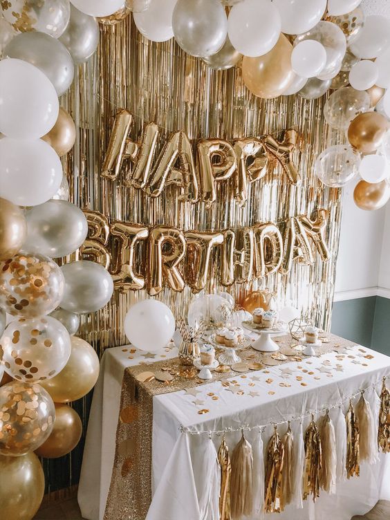 Quinceanera celebration with 18th birthday party decorations, featuring balloons and streamers