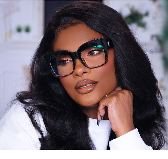 A woman wearing glasses and a white shirt from Zeelool - Quinceanera theme