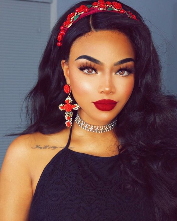 Beauty, a woman with long black hair and red lipstick, in a Quinceanera themed image